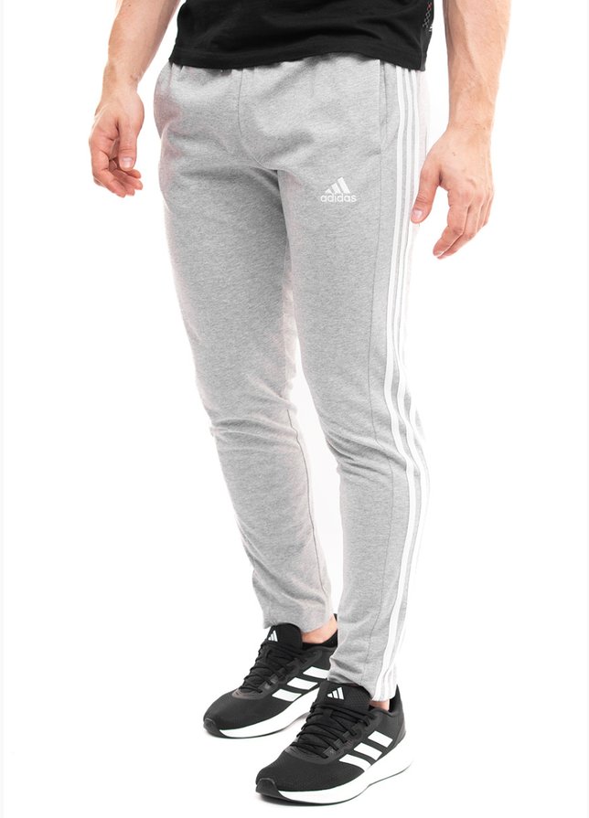 adidas Pantaloni bărbați Essentials Single Jersey Tapered Open Hem 3-Stripes IC0046 adidas Pantaloni bărbați Essentials Single Jersey Tapered Open Hem 3-Stripes IC0046